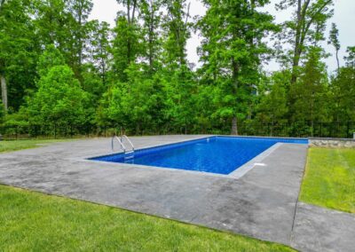 This inground pool installation job involved installing a 12x24 vinyl liner pool  with a concrete 5 ‘ tanning ledge and 6’ bench along one side. Quinton, VA