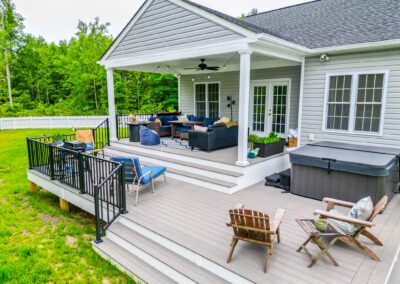 Construction of a covered composite backyard deck with railing, tying into a walkway to an inground pool | cleanstone construction | richmond, va