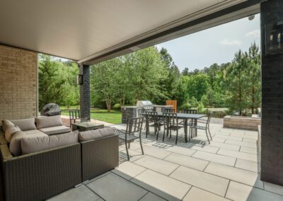 custom paver patio with furniture and composite deck | Henrico, VA