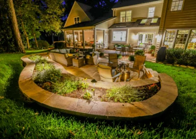 custom outdoor patio with outdoor lighting and furniture.