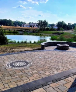 Outdoor patio with pavers overlooking lake. 