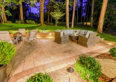 custom outdoor patio with outdoor lighting and furniture.