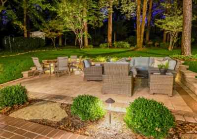 custom outdoor patio with outdoor lighting and furniture.