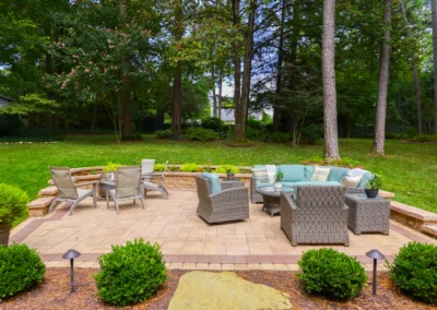 custom outdoor patio with outdoor lighting and furniture.