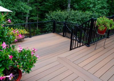 Deck with green plants around.